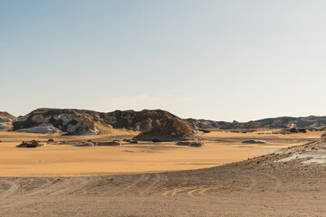 White rock formations and sand dunes in Egypt's White Desert, natural desert landscape	