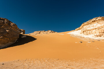 White rock formations and sand dunes in Egypt's White Desert, natural desert landscape	