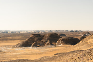 White rock formations and sand dunes in Egypt's White Desert, natural desert landscape	