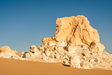 White rock formations and sand dunes in Egypt's White Desert, natural desert landscape	