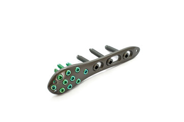A Distal fibula Plate with screw isolated on the white background.  Distal fibula  plate is used to fix a fractured a ankle bone joint.