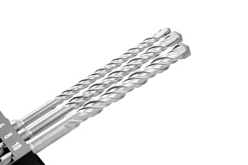 Set of three metallic drill bits displayed on a black holder, showcasing their twisted design and...