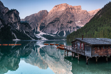 Serene sunset Lago di Braies or Pragser Wildsee at sunset.