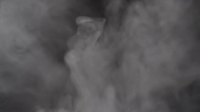 The captivating imagery of swirling smoke set against a dark backdrop is ideal for a wide range of creative projects