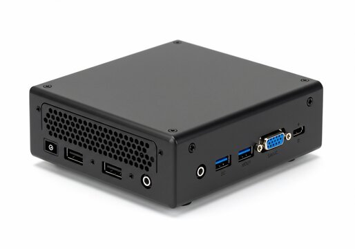 Compact black mini PC with various ports on a white background, studio shot