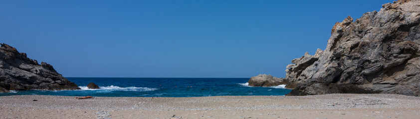 Panoramic view to the Nas pebble beach with rocky coast, Ikaria, Greece