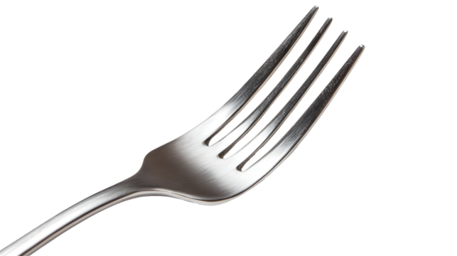 Close up of a shiny silver fork with four tines against a solid transparent background in a studio shot