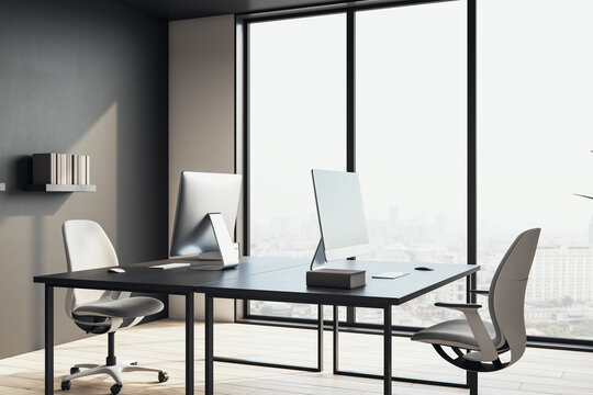 Modern black desk workspace with sleek chairs and large glass windows in high-rise office interior, overlooking a bright city view. 3D Rendering