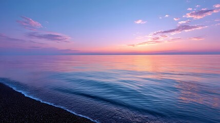 Fototapeta premium Tranquil sunset over the serene ocean waves.