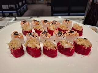 Delicious Sushi Presentation Featuring Creative Variations on a White Plate
