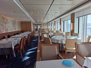Modern Dining Room Interior with Large Windows and Elegant Table Settings