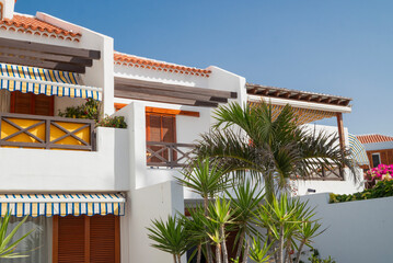 beautiful white houses for holiday vacation with palm trees on Tenerife island in Canary Islands Spain