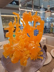 Close-Up of Vibrant Crystal-Like Candy Decoration in a Modern Setting