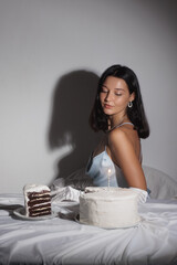 Elegant Woman in Blue Dress with Birthday Cake and Candle in Studio Light