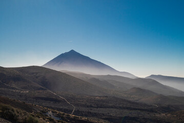 view of volcano Teide on Tenerife island on a sunny day with clouds