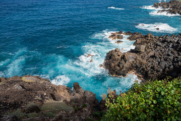 beautiful view of the beach ocean shore with rocks and cliffs with beautiful waves on the island of Tenerife Canary Islands Spain