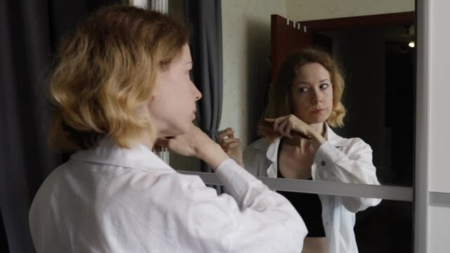 Female Patient Discovers Hair Loss in Mirror, Early Sign of Medical Treatment Reaction