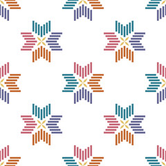 Abstract ethnic flower or snowflake seamless pattern.Ikat textile texture in Bohemian, Mexican,African, mediterranean style.Nordic folk art background.Design for happy holiday,nature winter,Christmas.