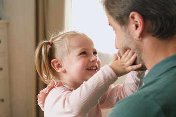 Happy Father Playing with Daughter. Three Years Baby Smiling, Laughing, Looking at Daddy. Man...
