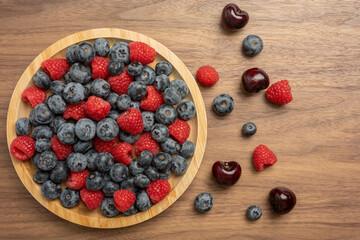 The High resolution fruit photo of mixed fruits including cherries, raspberries and blueberries...