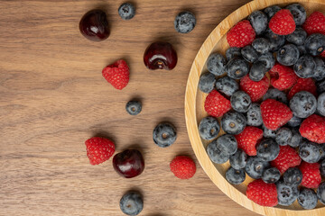 The High resolution fruit photo of mixed fruits including cherries, raspberries and blueberries...