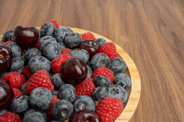 The High resolution fruit photo of mixed fruits including cherries, raspberries and blueberries...