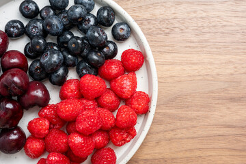 The High resolution fruit photo of mixed fruits including cherries, raspberries and blueberries...