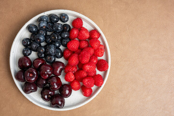 The High resolution fruit photo of mixed fruits including cherries, raspberries and blueberries...