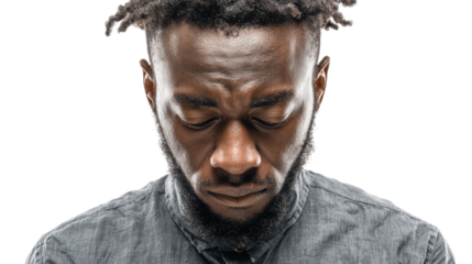Portrait of a thoughtful man looking down, isolated on a white background.