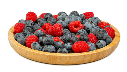 The High resolution fruit photo of mixed fruits including cherries, raspberries and blueberries arranged on a plate, taken with split focus technique.