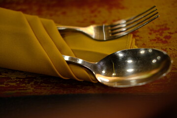 Elegant Cutlery Set Wrapped in Yellow Napkin, Fork and Spoon on Table Setting, Restaurant Ready,...