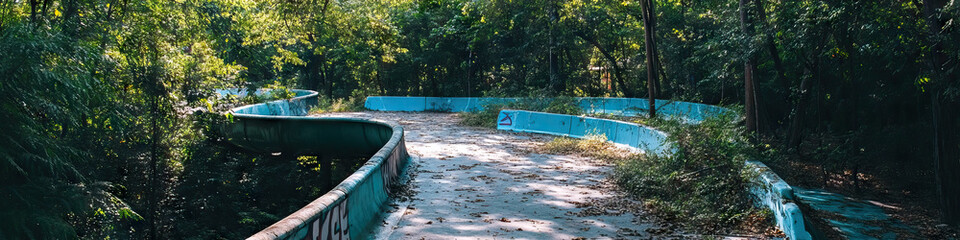 Abandoned Water Slide in Wooded Area