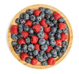 The High resolution fruit photo of mixed fruits including cherries, raspberries and blueberries arranged on a plate, taken with split focus technique.
