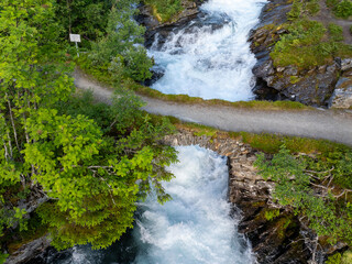 Old stone bridge in beautiful Norwegian nature. The bridge is built only of natural stones from...
