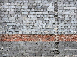Old mixed brick and cinder block wall