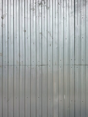 Vertical metal panel wall with wear marks