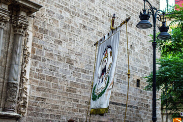 Procession of priests with flags during the Feast of Corpus Christi in Spain
