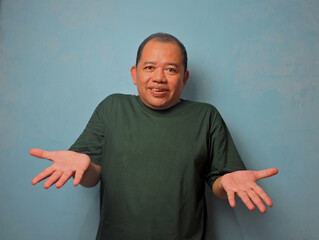 Confused Middle Aged Man Gesturing With Both Hands
