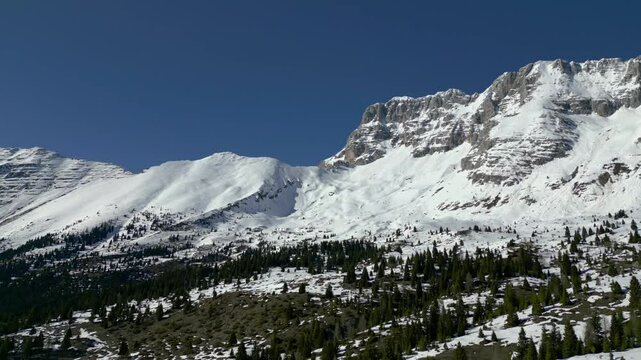 Spring snow on the Montasio plateau. Looking down on Montasio and Canin from above.