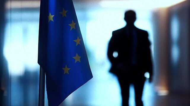 Silhouette of a man walking near a European Union flag in an office corridor. EU and USA trading deal. Tariffs and EU strategies concept animation. 