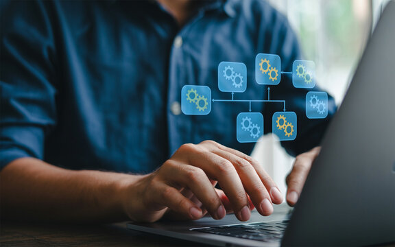 Man using laptop with process automation flowchart business workflow optimization and digital transformation for efficiency and productivity