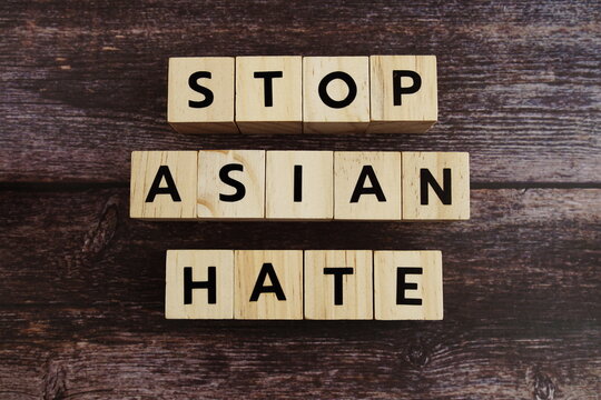 Stop Asian Hate word alphabet letters on wooden background