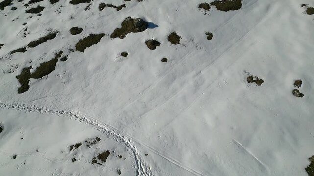 Spring snow on the Montasio plateau. Looking down on Montasio and Canin from above.