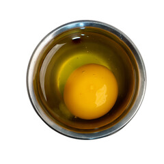 The Photo of raw eggs in a cooking cup