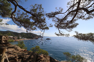 Views of the large beach of Tossa de Mar in the south of the Costa Brava in summer from the Castle wall