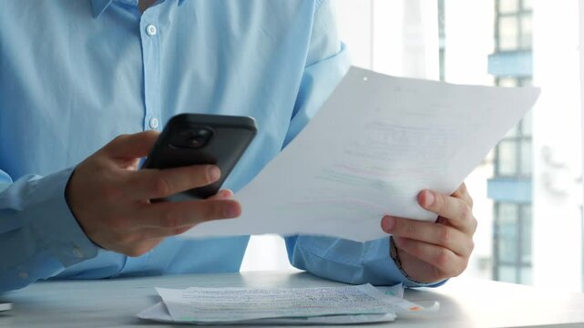 The bank employee familiarizes himself with the terms of the contract before lending.
Loan and documents.
Financial aid and paperwork.
Office routine and paperwork