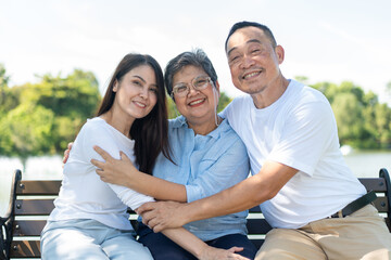 Daughter lovingly supports her elderly mother, capturing a beautiful family portrait filled with happiness and care. Their strong relationship creates cherished memories, celebrating warmth of family