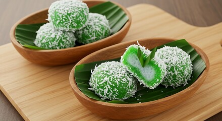 Klepon, also known as onde-onde, is indonesian traditional cake. Klepon is made from glutinous rice flour mixed with pandan juice and filled with liquid brown sugar and formed into small balls