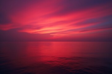 Obraz premium Reddish Purple Sunset Sky Reflection on Calm Sea ai generated