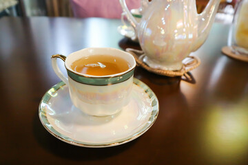 hot tea , tea cup and tea pot